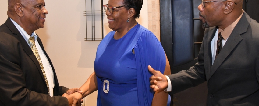 Minister of State in the Ministry of Agriculture, Fisheries and Mining, Hon. Franklin Witter (left) congratulates Director, Administration and Human Resources, National Irrigation Commission (NIC) Limited, Maxine Brown, on 35 years of sterling contribution to the agency. Looking on is Chief Executive Officer, Joseph Gyles. The event was the agency's 36th anniversary luncheon and long service awards ceremony on November 28 at the Jamaica Pegasus Hotel in New Kingston.