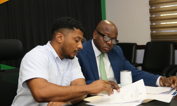 Minister of Agriculture and Fisheries, the Hon. Pearnel Charles Jr, flanked by Mr. Kevin Condappa, the Acting Principal Director of Agricultural Economic Planning & Policy,