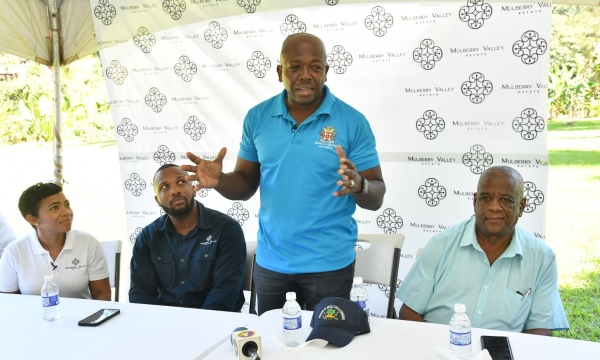 Minister of Agriculture and Fisheries, Hon. Pearnel Charles Jr., delivers remarks during a tour of the Mulberry Valley Estate in Friendship Gap, St. Mary, on Thursday (January 26). At right is State Minister in the Ministry, Hon. Franklin Witter. Also listening are property owners and entrepreneurs, Nicole and Jeffrey Campbell.